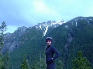 woman hiking with mountains in background