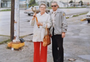 parents holding olympic torch
