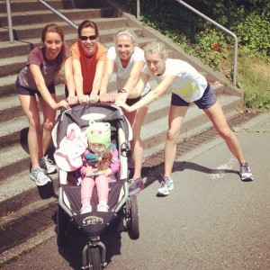 women pushing jogging stroller