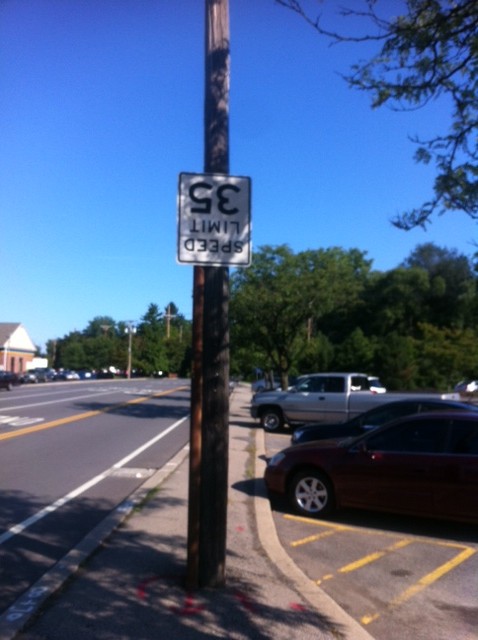 upside down road sign