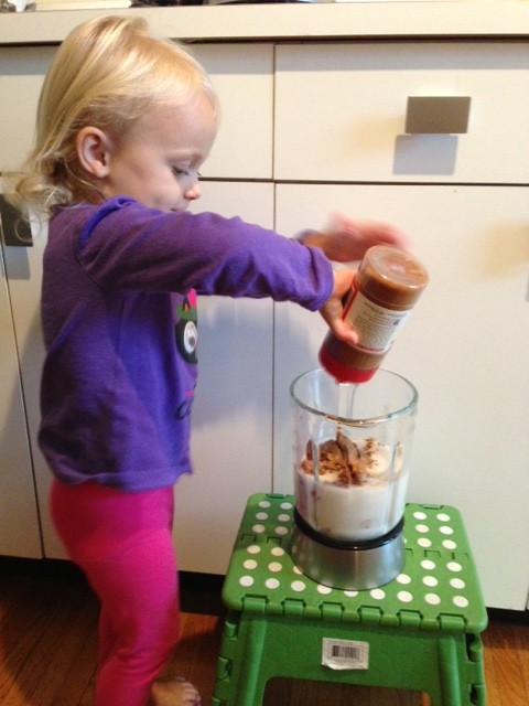 toddler making smoothies