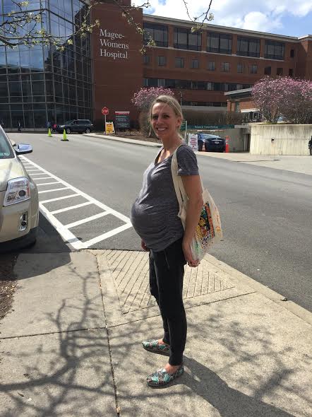 Posing in front of the hospital after finding out I was going to be induced.